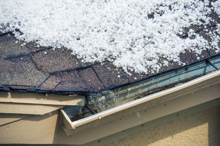 Hail impacting an asphalt shingle roof